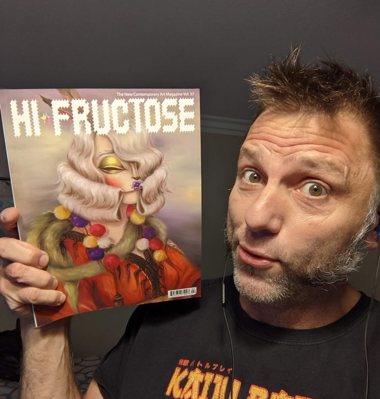 The artist, Tom Sepe, Holding Hi-Fructose magazine